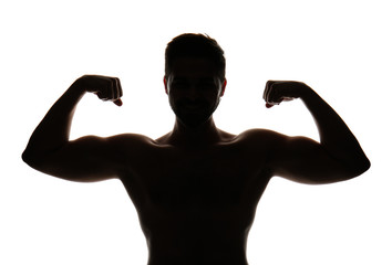 Fototapeta premium Silhouette of sporty young man on white background