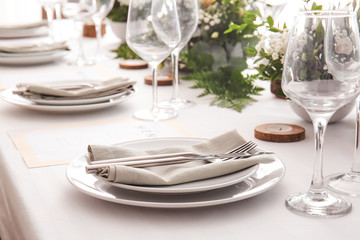 Beautiful table setting for wedding celebration in restaurant