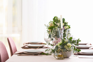 Beautiful table setting for wedding celebration in restaurant