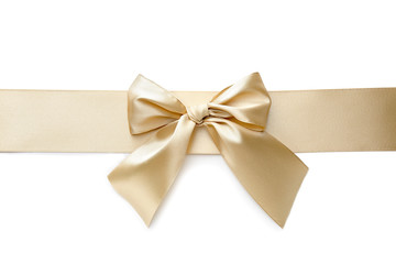 Golden ribbon with beautiful bow on white background
