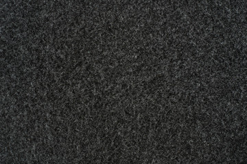 Fragment of a synthetic pile coating in black