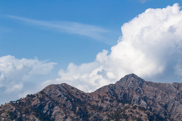 Beauutiful mountains with clouds in the sky. Nature and earth concept