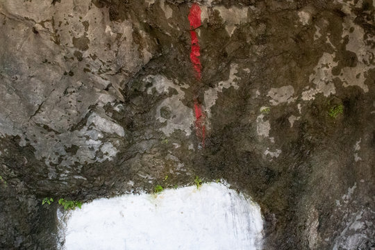 Red teeka made on a rock wall for worshipiing Goddess Durga in Hindu mythology