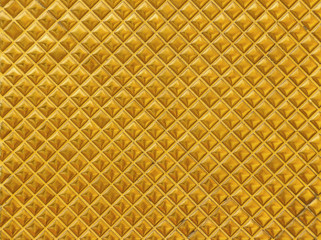 Luxury golden square grid shape tile pattern wall background.