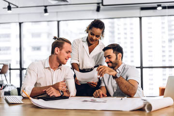 Group of professional business meeting and discussing strategy with new startup project.Creative business people planning and brainstorm with document report in modern workloft.Teamwork concept