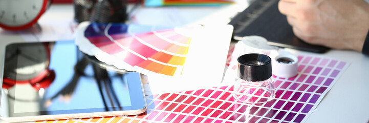 Test print paper page with colour test design fantail and magnifying glass