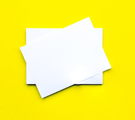 Blank business cards on yellow background