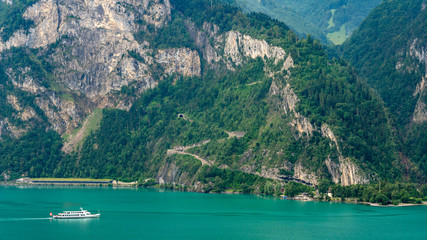Fototapeta na wymiar Switzerland, Panoramic view on green Swiss Alps near Isleten.