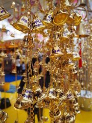 Fototapeta na wymiar Close up of polished brass bells hanging bunch at thailand temple