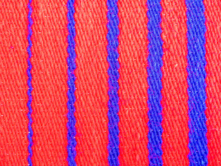 Bright red and blue striped woven wool.
