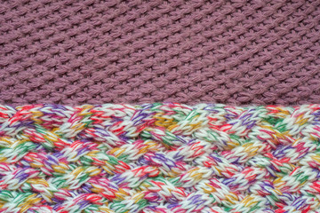 Knitted carpet closeup. Knitted texture. Detailed warm yarn background. Knit wool. Natural woolen fabric, sweater fragment.