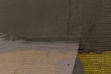 Plastering slabs of mineral wool (rock wool, mineral cotton) insulation with reinforcing mesh and...