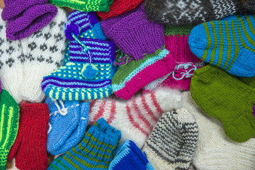 Background from wool products. Socks, mittens.