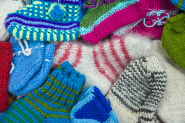 Background from wool products. Socks, mittens.