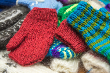Background from wool products. Socks, mittens.