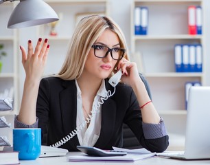 Busineswoman frustrated working in the office