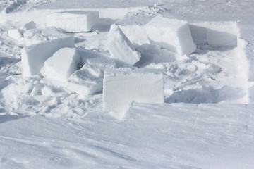 Fototapeta na wymiar Block of snow for building an igloo in a snow glade