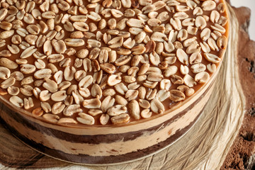 Cake with peanuts and caramel, close-up. Homemade cakes, small business.