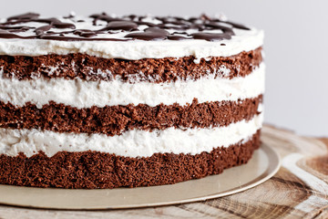 Cake with dark chocolate poured from above. Homemade cakes, small business.