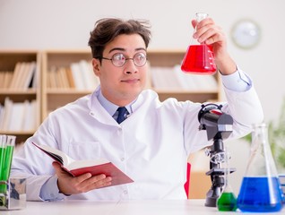 Mad crazy scientist doctor doing experiments in a laboratory