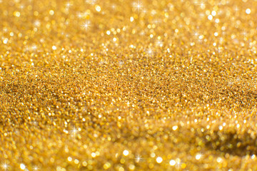 Abstract bokeh background. Christmas Glittering background. Yellow christmas background,