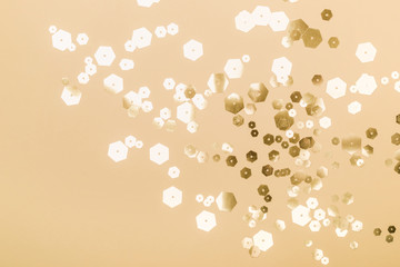 Festive Pastel background with trendy hexagonal sparkles in beige colors. Holiday Party Concept