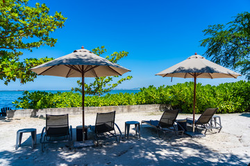 Umbrella and chair on the beach and sea with blue sky