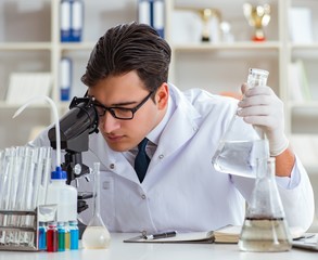 Fototapeta premium Young researcher scientist doing a water test contamination expe