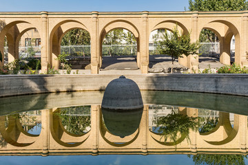 Obraz na płótnie Canvas Arch walls reflection in pool water, Masoudieh historic mansion, Tehran, Iran