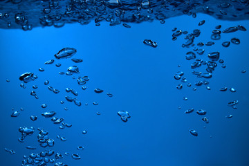 surface Bubbles under Blue water back ground Copy space