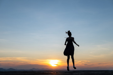 silhouette of a person runaway in the sunset