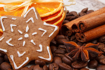 Decorated gingerbread, coffee grains and spices, christmas time