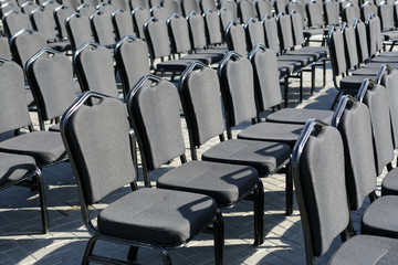 Obraz premium Rows of gray chairs. Street concert, conference, presentation.