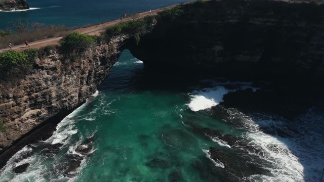 Ocean view to the Devill eye coast formation with blue lazure ocean water. Bali Indonesia