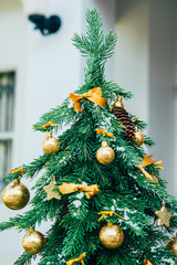 Christmas background. Green fir tree with golden balls. - 301905407