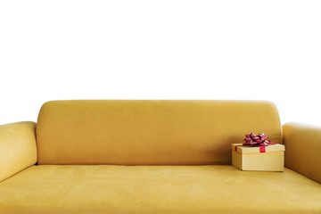 Yellow sofa with yellow gift box, isolated on white background