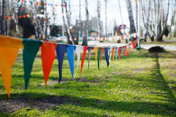 Multicolored triangular festival flags.