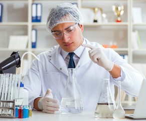 Young researcher scientist doing a water test contamination expe