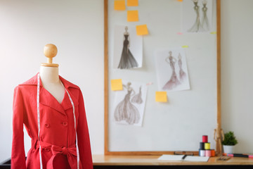 Cropped shot view of Fashion Designer stylish showroom working as fashion and drawing sketches for clothes in atelier.