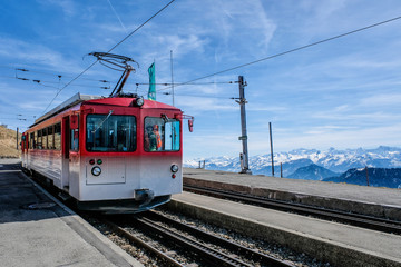 Fototapeta na wymiar Famous electric red tourist swiss train on Rigi mountain,Switzerland,Europe