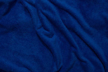 Fototapeta na wymiar Background image texture from a blue soft blanket.