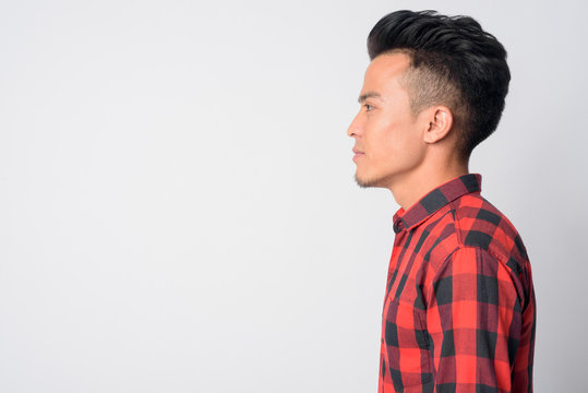 Closeup profile view of young Asian hipster man