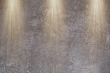 Cement wall surface with Down lights for backdrop wallpaper and background.