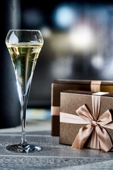 Gift boxes and a glass of champagne. Copyspace for text.
