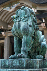 Un-gyo  Komainu lion-dog guarding the entrance of Hokoku Shrine. Osaka Castle. Japan