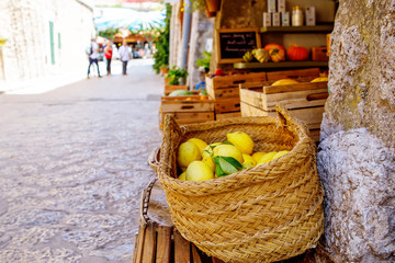 Fresh ripe lemons on a market in old village. Portugal