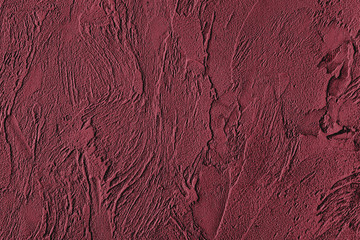 Dark red colored low contrast Concrete textured background with roughness and irregularities to your design or product. Color trend concept.