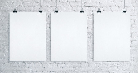 Three placard on brick wall