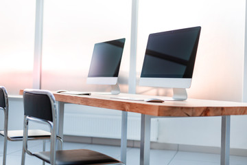 close up. modern computers on a wooden table
