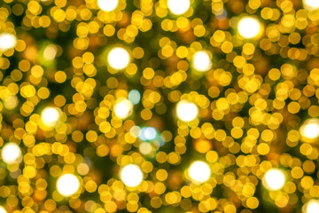 Blurred and bokeh of Christmas lighting in full screen background.